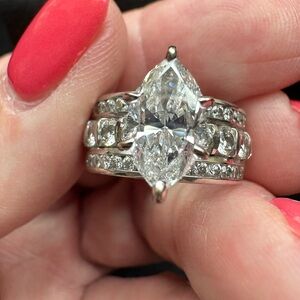 2ct marquee cut genuine diamond in 1.35ct genuine diamond setting. 14k wg band.